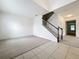 Spacious foyer with tile flooring leads to carpeted living areas and staircase at 771 Cavan Dr, Apopka, FL 32703