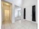Tiled foyer featuring an office area and a front door at 771 Cavan Dr, Apopka, FL 32703