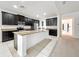 Large kitchen with center island, stainless steel appliances, and dark cabinetry at 771 Cavan Dr, Apopka, FL 32703
