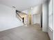Open living room with staircase, tile foyer, and view of kitchen at 771 Cavan Dr, Apopka, FL 32703
