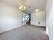 Comfortable living room with carpet flooring next to a staircase at 771 Cavan Dr, Apopka, FL 32703
