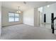Bright living room with carpet, and a view of the home's entrance at 771 Cavan Dr, Apopka, FL 32703