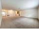 Spacious living room featuring neutral carpet and paint, with ample natural light throughout at 771 Cavan Dr, Apopka, FL 32703