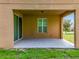 The outdoor patio is sheltered, has a fan, and sliding glass doors to the home's interior at 771 Cavan Dr, Apopka, FL 32703