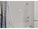 Bathroom featuring a tub with shower and a grey curtain at 8401 Riverdale Ln # 8401, Davenport, FL 33896