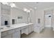 Bathroom featuring double sinks, a shower, a soaking tub, and white cabinets at 8401 Riverdale Ln # 8401, Davenport, FL 33896