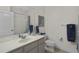 Clean bathroom with a white vanity, sink, toilet and tiled floors at 8401 Riverdale Ln # 8401, Davenport, FL 33896