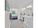 Spacious bathroom with double sinks, soaking tub, and access to bedroom at 8401 Riverdale Ln # 8401, Davenport, FL 33896