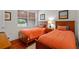 Bedroom features two twin beds with wooden frames and wood flooring at 8401 Riverdale Ln # 8401, Davenport, FL 33896