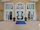 Elegant building entrance featuring glass doors and a Bella Trae welcome mat at 8401 Riverdale Ln # 8401, Davenport, FL 33896
