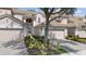 Charming townhome featuring a well-maintained tile roof, two-car garage, and lovely landscaping at 8401 Riverdale Ln # 8401, Davenport, FL 33896
