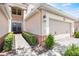 Close-up of the garage showcasing the exterior details and landscaping at 8401 Riverdale Ln # 8401, Davenport, FL 33896