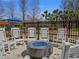 Inviting outdoor fire pit area with comfortable seating and attractive landscaping at 8401 Riverdale Ln # 8401, Davenport, FL 33896