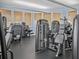 Bright fitness center with various weight machines and a black rubber floor at 8401 Riverdale Ln # 8401, Davenport, FL 33896
