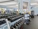 Community fitness center with a variety of dumbbells and weight-lifting equipment at 8401 Riverdale Ln # 8401, Davenport, FL 33896