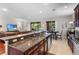 Gourmet kitchen boasting granite countertops, stainless appliances, and an open concept layout to the living area at 8401 Riverdale Ln # 8401, Davenport, FL 33896