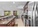 Spacious kitchen featuring granite countertops, stainless steel appliances, and ample cabinet space at 8401 Riverdale Ln # 8401, Davenport, FL 33896