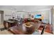 Open concept floor plan with dining area flowing into a comfortable living room at 8401 Riverdale Ln # 8401, Davenport, FL 33896