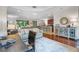 Open-concept living room flowing into kitchen with modern decor and wood floors at 8401 Riverdale Ln # 8401, Davenport, FL 33896