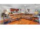 Expansive living room flowing into dining and kitchen with hardwood floors at 8401 Riverdale Ln # 8401, Davenport, FL 33896