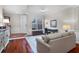 Bright living room with front door, staircase, and contemporary furniture at 8401 Riverdale Ln # 8401, Davenport, FL 33896