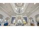 Stately lobby featuring soaring ceilings, a striking chandelier, and elegant blue curtains at 8401 Riverdale Ln # 8401, Davenport, FL 33896