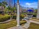 Outdoor shower near a shaded seating area, offering a private space to rinse off after a swim at 8401 Riverdale Ln # 8401, Davenport, FL 33896