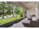 Relaxing screened-in patio featuring scenic lake views and comfortable seating at 8401 Riverdale Ln # 8401, Davenport, FL 33896
