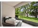 Screened patio with comfortable seating overlooking a tranquil lake and lush greenery at 8401 Riverdale Ln # 8401, Davenport, FL 33896