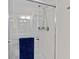 Shower with glass door and a blue towel hanging on the rail at 8401 Riverdale Ln # 8401, Davenport, FL 33896