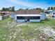 Aerial view of backyard with covered patio at 925 Roswell Ter, Deltona, FL 32738