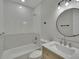 Modern bathroom with white subway tile, updated fixtures, and stylish vanity at 925 Roswell Ter, Deltona, FL 32738