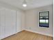 Bedroom boasts bright light, three closets, and views from a window at 925 Roswell Ter, Deltona, FL 32738