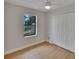 Bedroom with wood-look floor and ample closet space, offering comfort and functionality at 925 Roswell Ter, Deltona, FL 32738