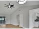 Open-concept living area featuring vaulted ceilings, modern ceiling fan, and light-colored flooring at 925 Roswell Ter, Deltona, FL 32738