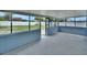 Enclosed patio features a concrete floor and cinder block walls at 925 Roswell Ter, Deltona, FL 32738