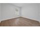 Bedroom with hardwood floors, natural light, and neutral decor at 946 Little Creek Rd, Orlando, FL 32825