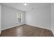 Cozy bedroom with hardwood floors and a window at 946 Little Creek Rd, Orlando, FL 32825