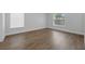 Large bedroom with hardwood flooring and white trim at 946 Little Creek Rd, Orlando, FL 32825