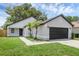 Charming single Gathering home with a well-manicured lawn and a two-car garage at 946 Little Creek Rd, Orlando, FL 32825