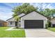 Charming single Gathering home with a well-manicured lawn and a two-car garage at 946 Little Creek Rd, Orlando, FL 32825
