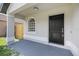 A cozy porch with black door welcomes you to your new home at 946 Little Creek Rd, Orlando, FL 32825