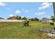 Spacious backyard includes a shed, lush lawn, and white fencing for privacy at 954 Revere Ave, Haines City, FL 33844