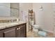 Bathroom boasts granite countertops and a vanity for storage at 954 Revere Ave, Haines City, FL 33844