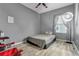 Minimalist bedroom with gray walls, vinyl floors, and a comfortable place to rest at 954 Revere Ave, Haines City, FL 33844