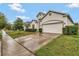 A beautiful single-Gathering home featuring a two-car garage and well-manicured landscaping at 954 Revere Ave, Haines City, FL 33844