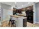 Kitchen with dark cabinets, granite countertops, stainless steel appliances, and tile floors at 954 Revere Ave, Haines City, FL 33844