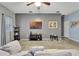 Comfortable living room features a plush couch, neutral gray walls, and ceiling fan at 954 Revere Ave, Haines City, FL 33844