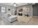 Open concept living room featuring neutral walls, plush carpeting, and large windows at 954 Revere Ave, Haines City, FL 33844
