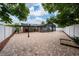 Spacious backyard featuring a large brick patio, an enclosed pool area, and a well-maintained privacy fence at 112 Rosewood Ct, Kissimmee, FL 34743
